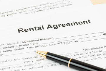 Rental agreement document with pen