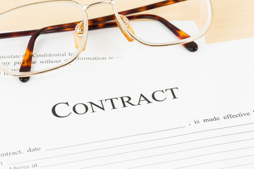 Business contract document with glasses