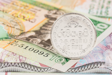 Fototapeta premium Sri Lanka money banknote focus on coin