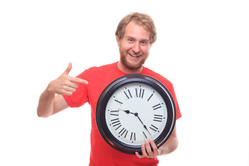 Bearded happy man holding big clock and smiling