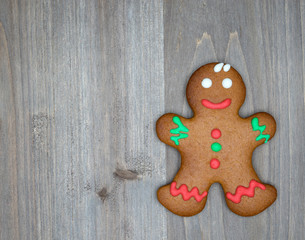 Christmas still life with traditional gingerbread cookies on woo