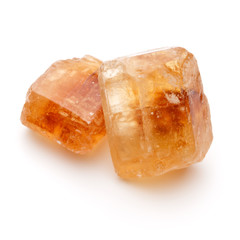 Brown caramelized lump cane sugar cube isolated on white backgro