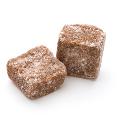 Brown lump cane sugar cube isolated on white background cutout