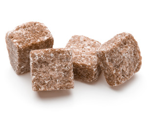 Brown lump cane sugar cube isolated on white background cutout