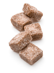 Brown lump cane sugar cube isolated on white background cutout