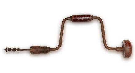 Old hand drill carpenter tool isolated on white background