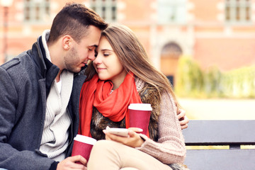 Romantic couple on a bench in the park