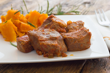 Pork stew garnished with pumpkin