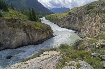 Fototapeta na wymiar Rapids on mountain river