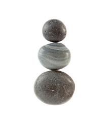 Three smooth stones isolated over white