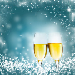 Champagne glasses against holiday lights