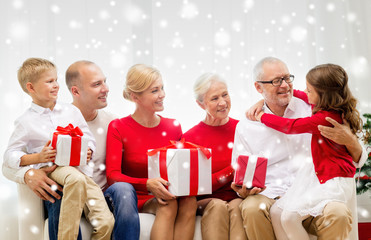 smiling family with gifts at home