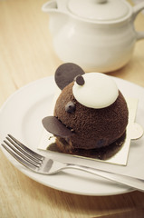 Chocolate cake on wooden table close-up