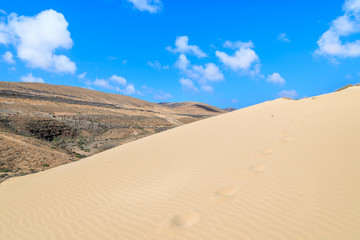 Footprints on sand dune at Sotavento beach, Fuerteventura island