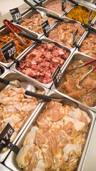 Variety of meat displayed in butcher's shop