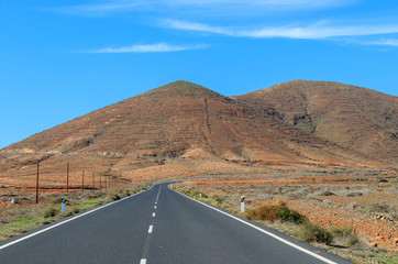Fototapeta na wymiar Scenic mountain road and volcano view, Tuineje, Fuerteventura