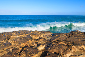 Rocks and ocean wave on La Pared beach, Fuerteventura island