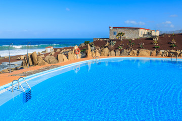 Swimming pool in mountain landscape of Fuerteventura island