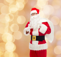 man in costume of santa claus with bag