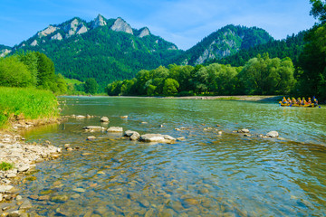 Dunajec river and tourist boat on water, Pieniny, Poland