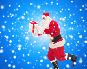 man in costume of santa claus with gift box