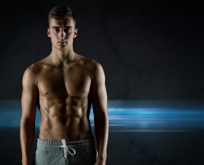 Fototapeta na wymiar young male bodybuilder with bare muscular torso