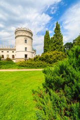 Fototapeta na wymiar Green gardens of Krasiczyn castle on sunny summer day, Poland