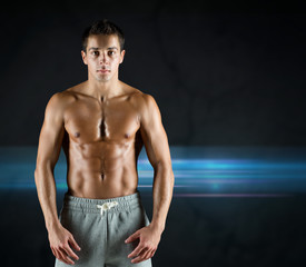 Fototapeta na wymiar young male bodybuilder with bare muscular torso