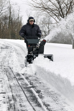Man Clearing Driveway of Snow