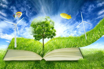 green micro world, book covered with grass wind energy turbines