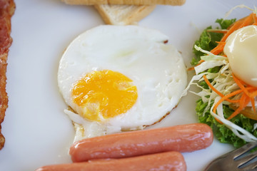 Fried egg on white plate