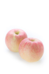 apple fuji fruit with water drops on white background