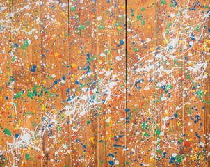 Mixed color splatter on wood wall backround