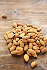 almonds on wooden surface