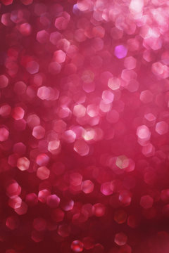 Red glittering christmas lights. Blurred abstract background