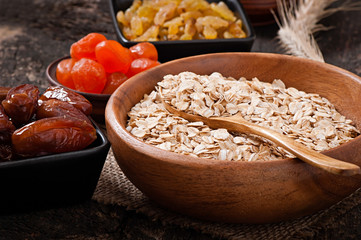 Cereal and dried fruit in a wooden bowl