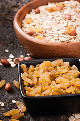 Cereal and dried fruit in a wooden bowl