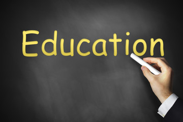 hand writing education on black chalkboard