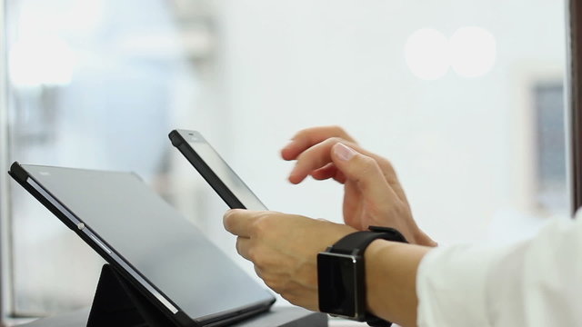 Young woman scanning qr code with smart phone