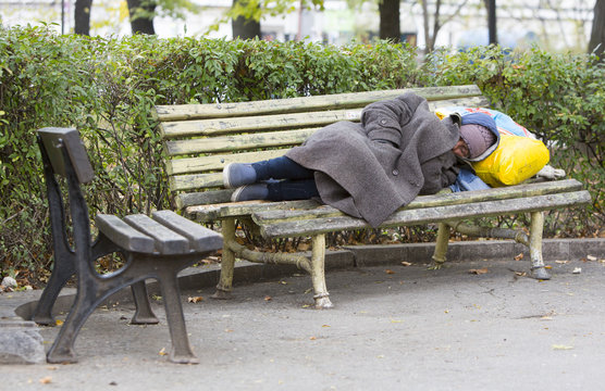 Homeless Man Sleeping On A Bench Stock Photo Adobe Stock