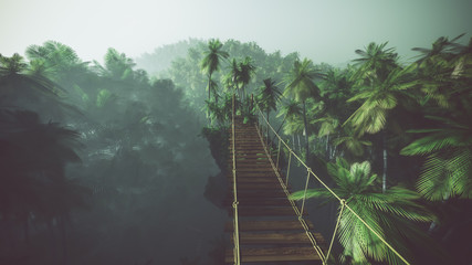 Rope bridge in misty jungle with palms. Backlit. - obrazy, fototapety, plakaty