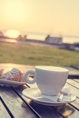 Cup of coffee and tasty biscuits