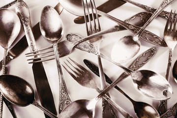 Old disordered tableware closeup