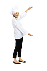 Smiling woman chef welcoming you to her workplace.