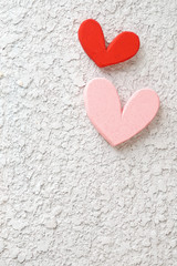 pink and red heart on concrete wall