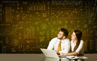 Business couple with diagram background