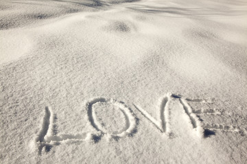 Fototapeta na wymiar Love handwriting on the fresh snow