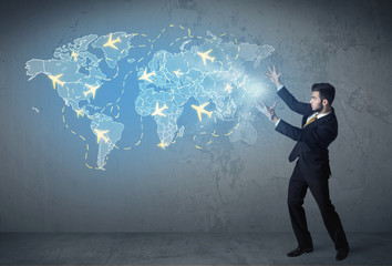 Business person showing digital map with planes around the world