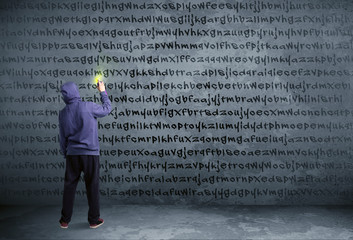 Young urban painter drawing