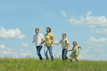 Happy family running outdoors